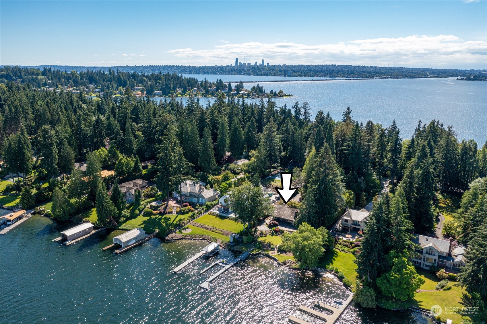 4232 Hunts Point Road Hunts Point, WA 98004 - Photo 11 of 23 a view of a lake with a mountain in the back