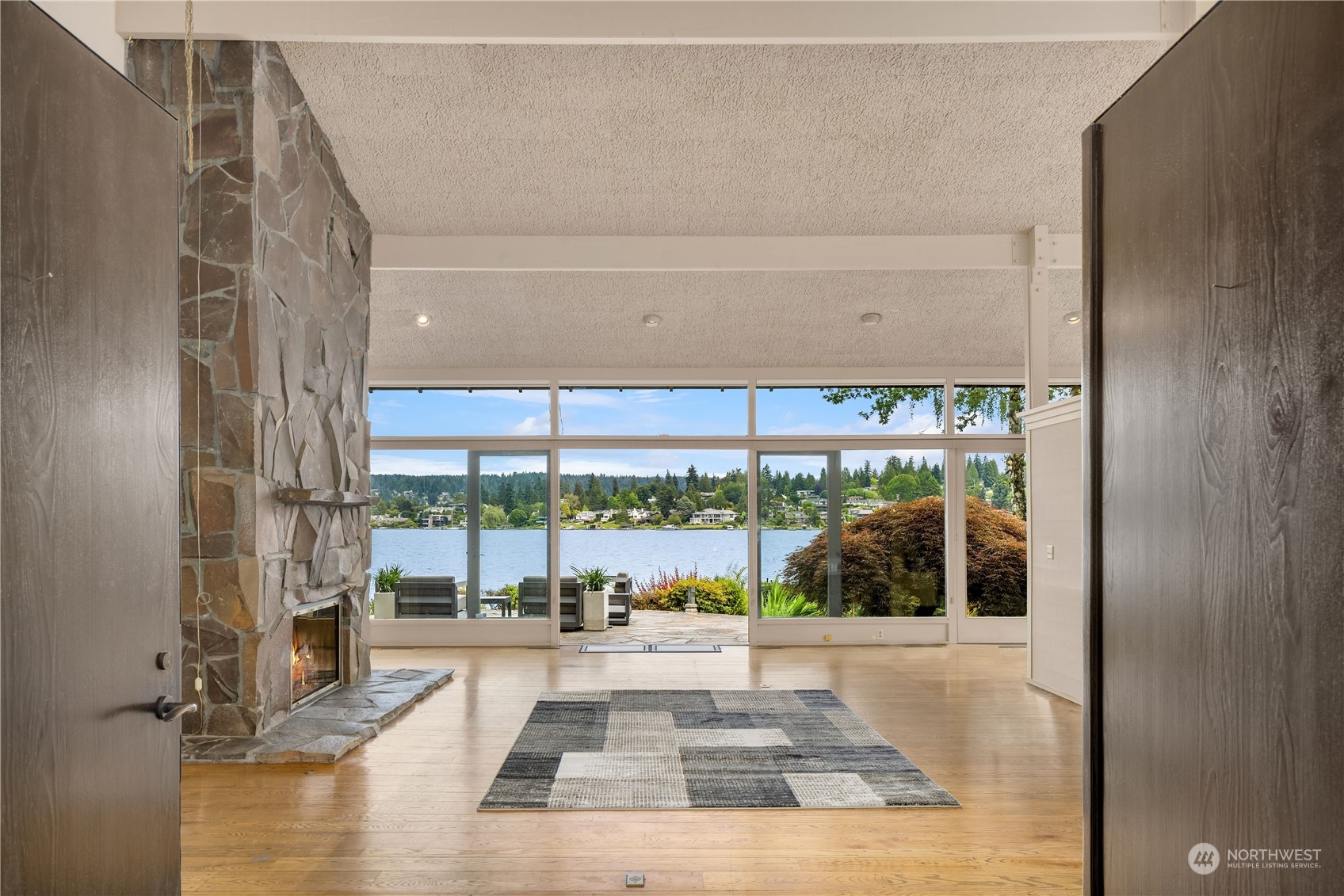 4232 Hunts Point Road Hunts Point, WA 98004 - Photo 16 of 23 a view of a living room and a floor to ceiling window