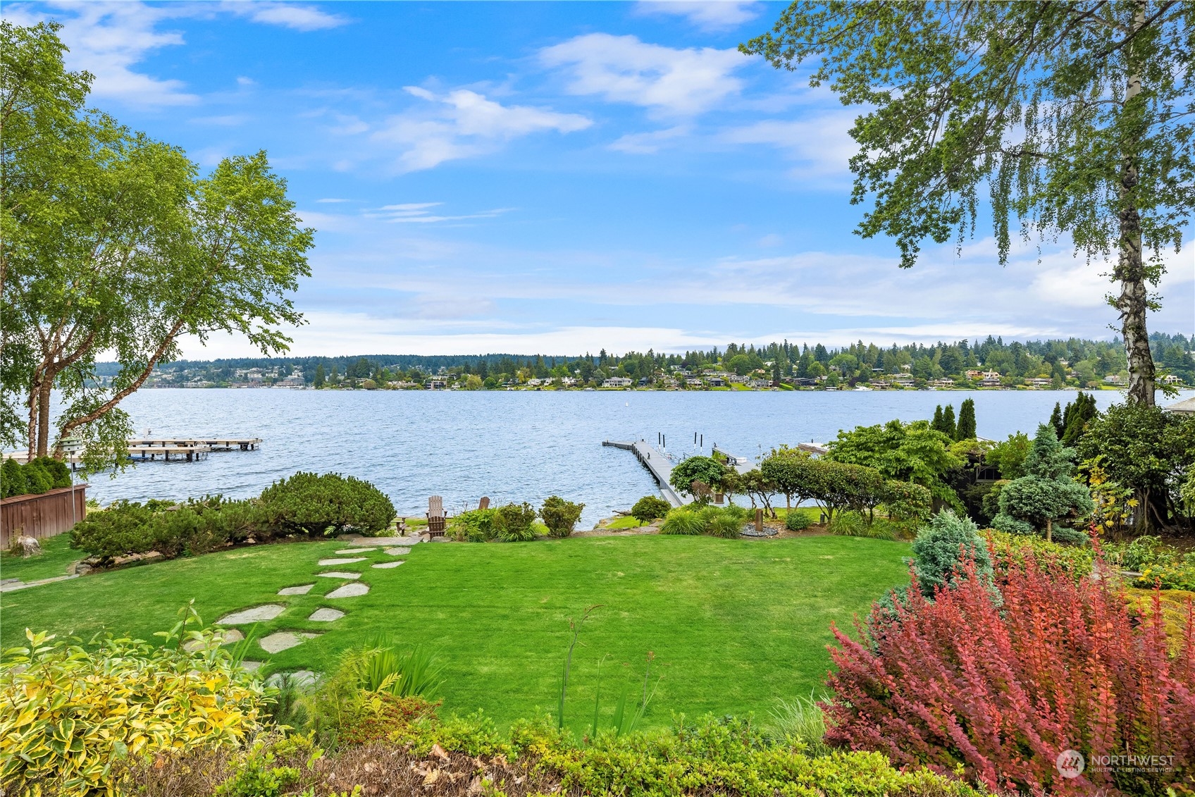 4232 Hunts Point Road Hunts Point, WA 98004 - Photo 20 of 23 a view of a lake with houses in the back