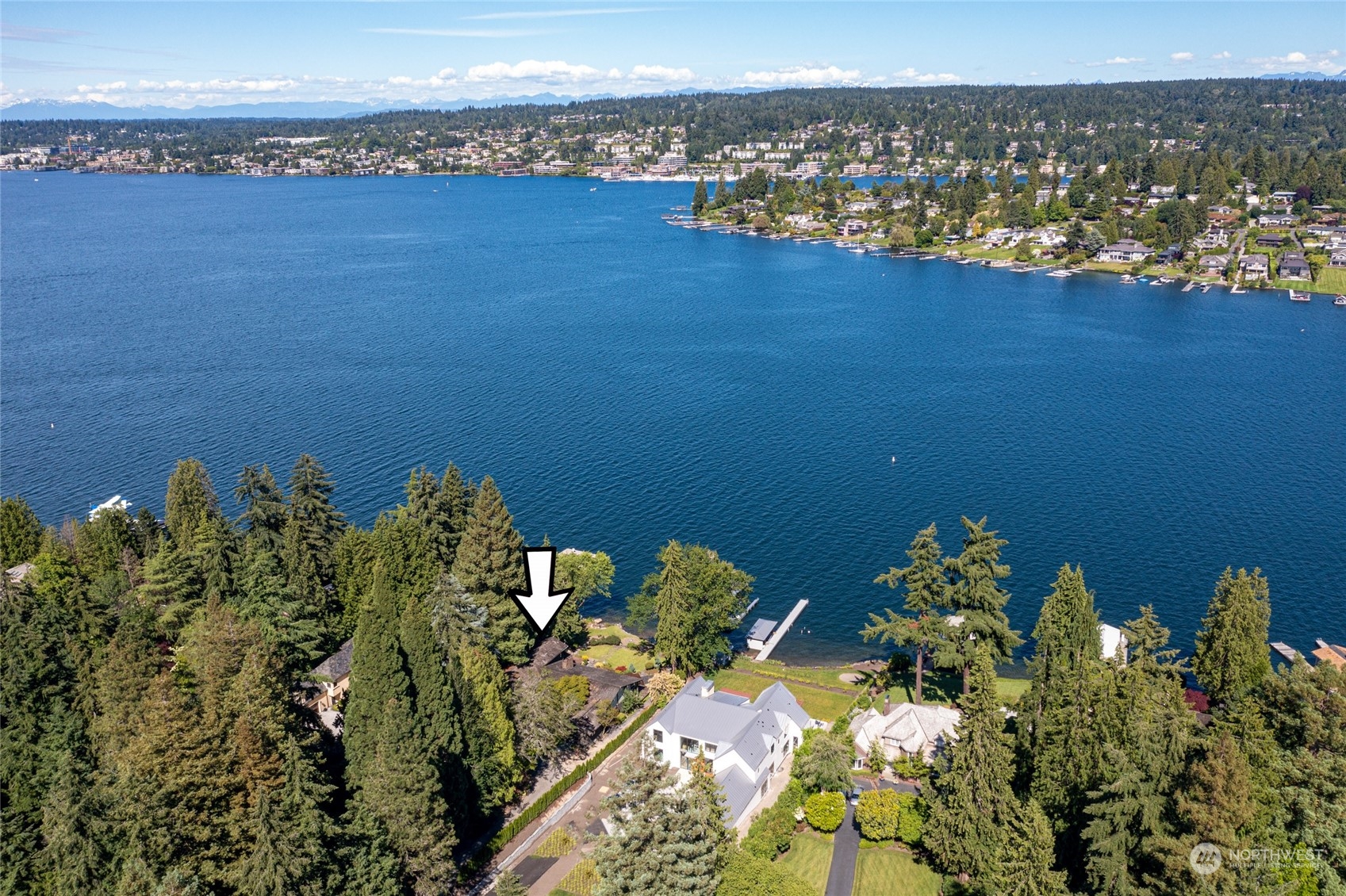 4232 Hunts Point Road Hunts Point, WA 98004 - Photo 22 of 23 a view of a lake with a mountain and a lake