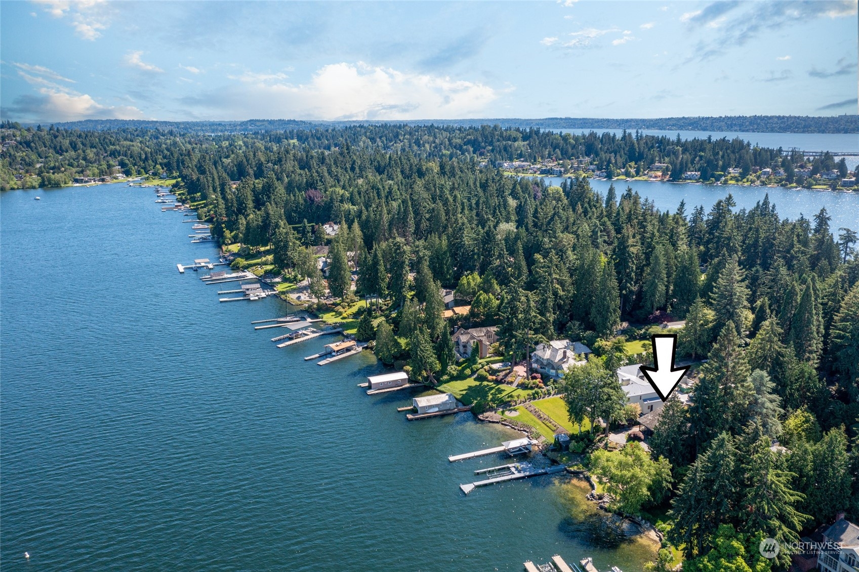 4232 Hunts Point Road Hunts Point, WA 98004 - Photo 10 of 23 an aerial view of a house with a lake view