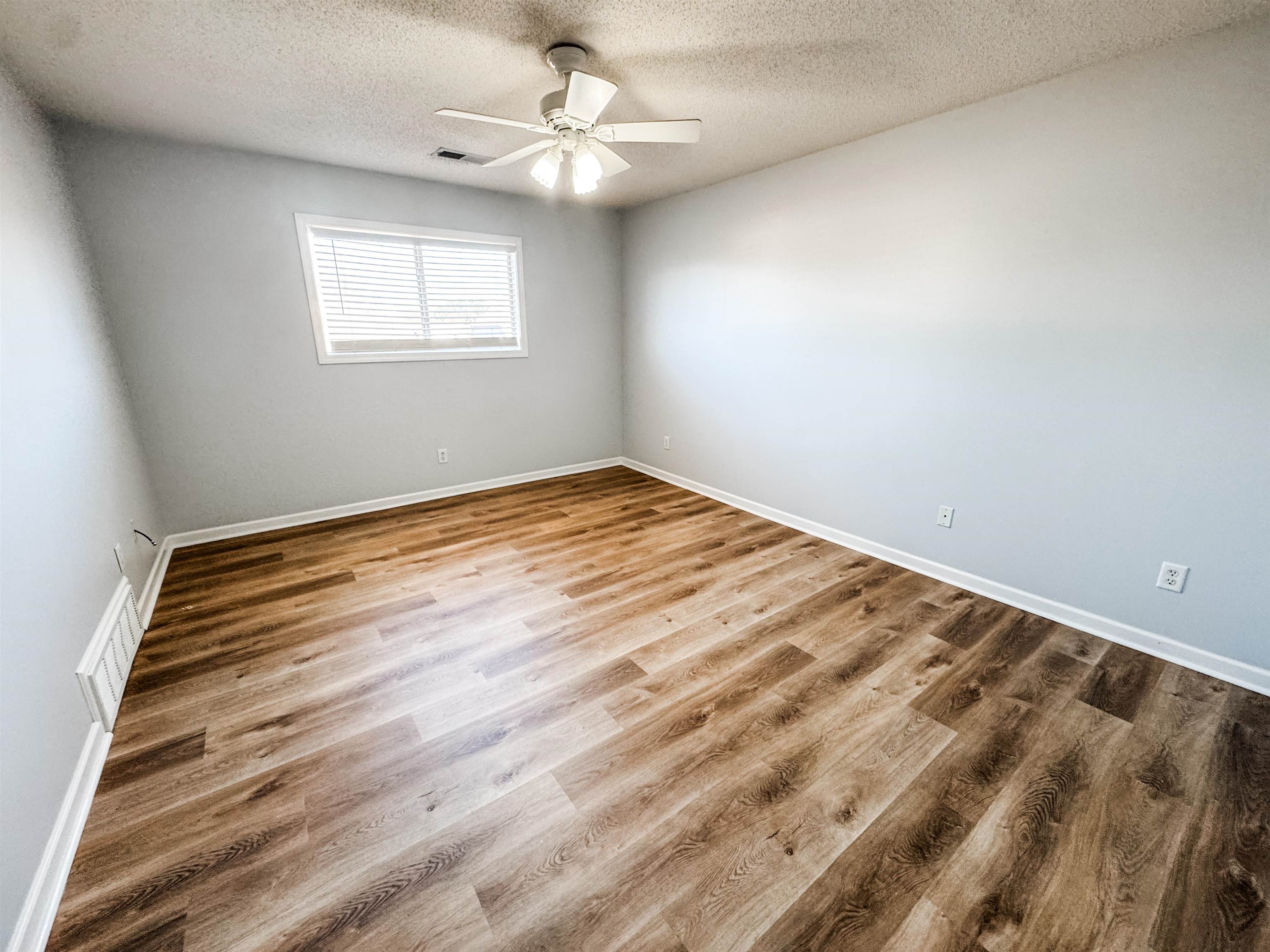 472 Hunters Mill Cove Collierville, TN 38017 - Photo 12 of 15 wooden floor in an empty room