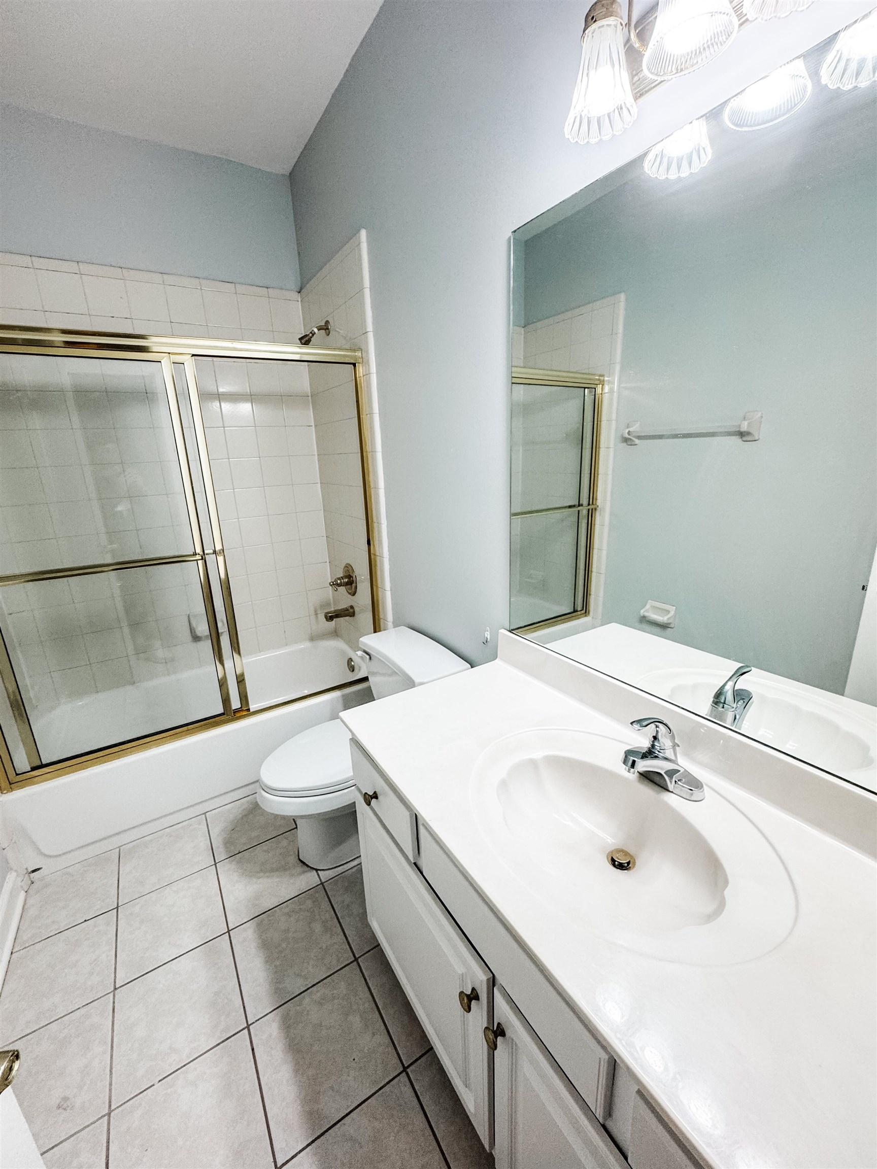 472 Hunters Mill Cove Collierville, TN 38017 - Photo 9 of 15 a bathroom with a sink a toilet and mirror