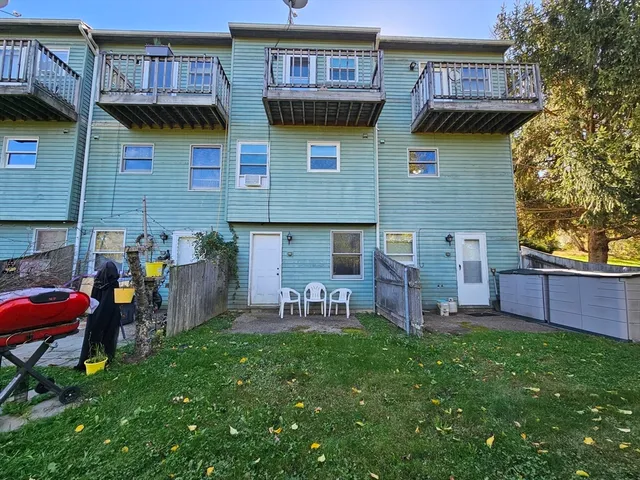 a front view of a house with a garden and plants
