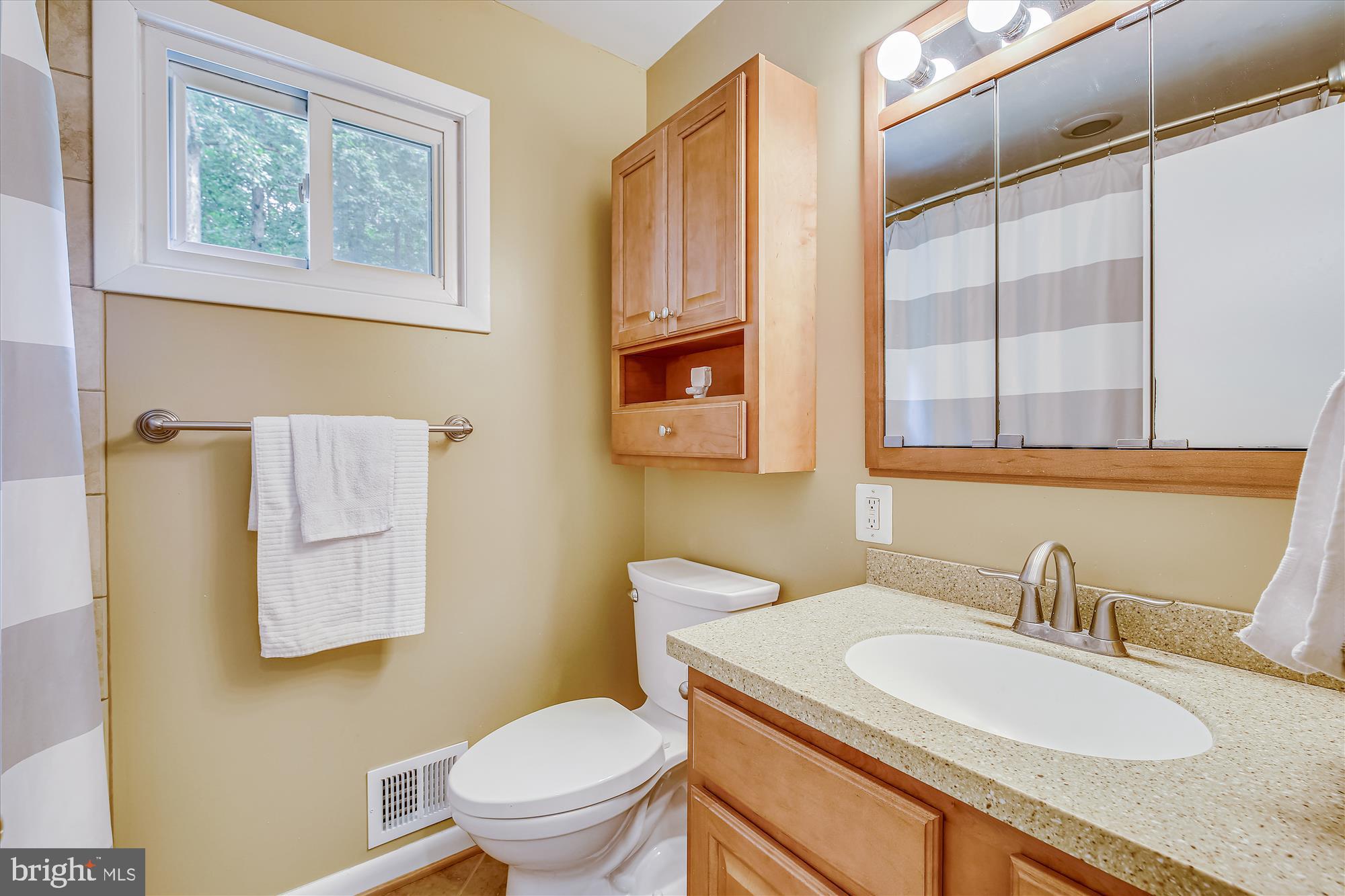 108 Claybrook Drive Silver Spring, MD 20902 - Photo 17 of 30 a bathroom with a granite countertop toilet sink and mirror