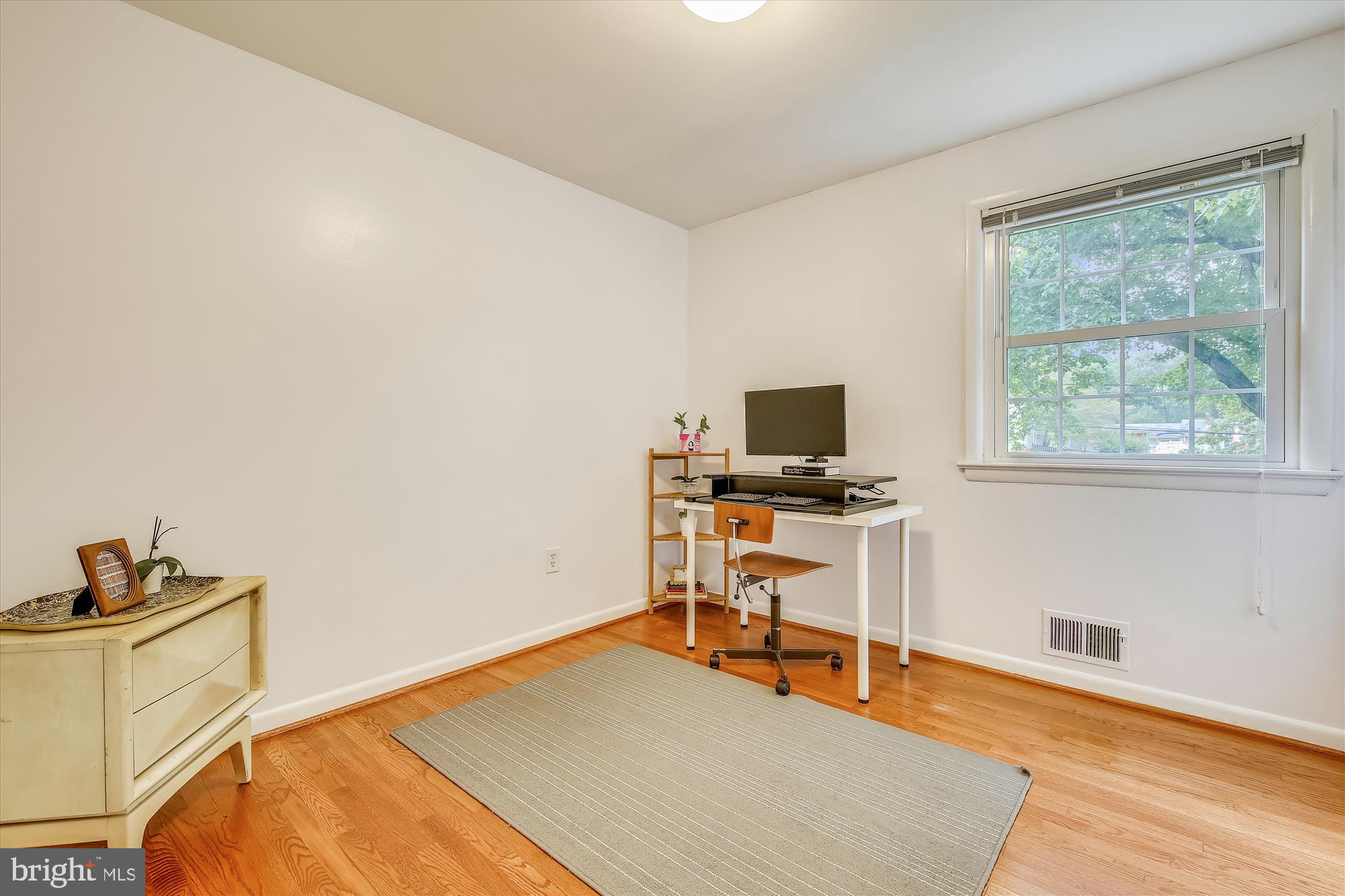 108 Claybrook Drive Silver Spring, MD 20902 - Photo 20 of 30 a room with a bed and a window