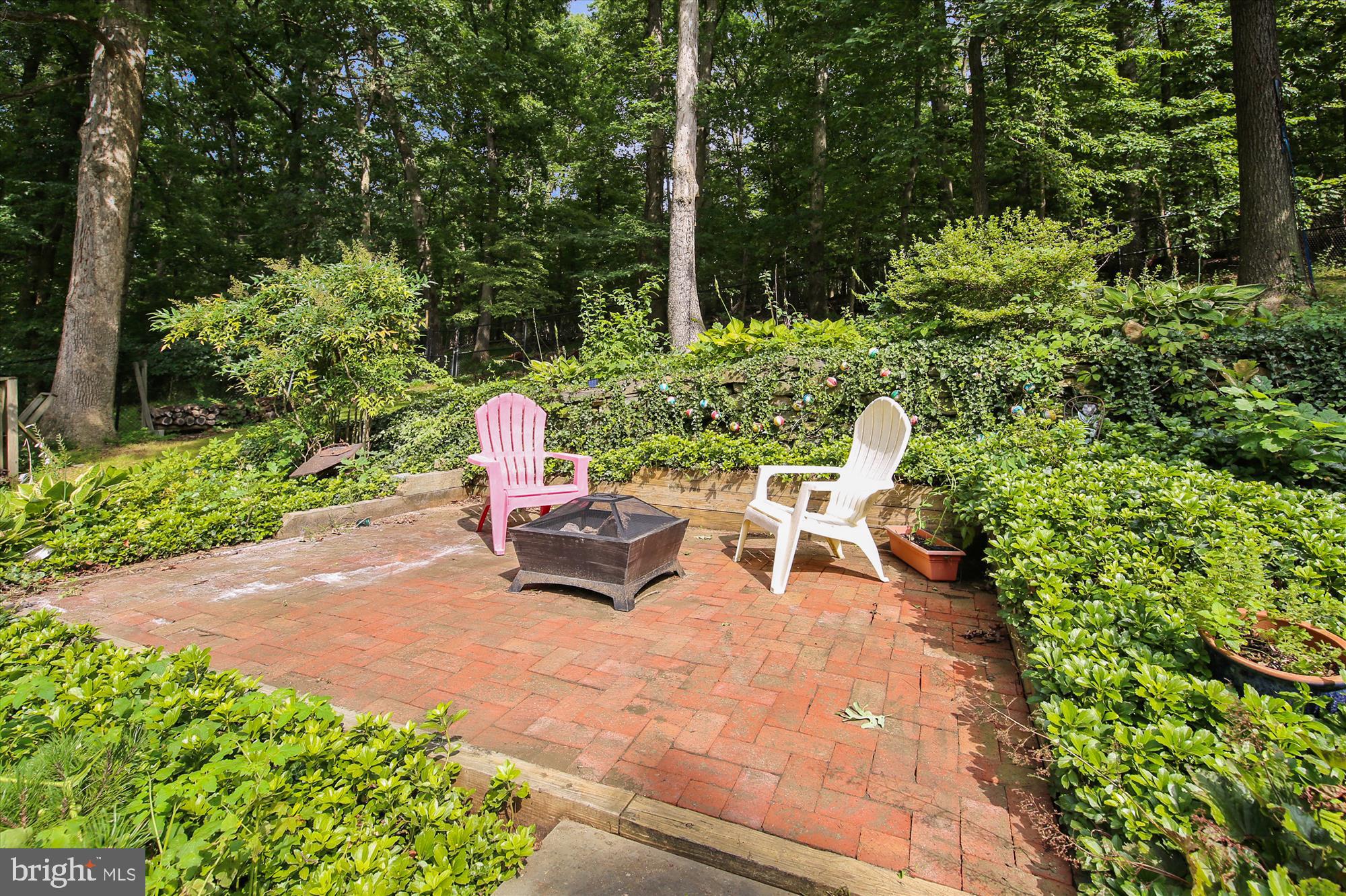 108 Claybrook Drive Silver Spring, MD 20902 - Photo 27 of 30 a view of a bench in the garden