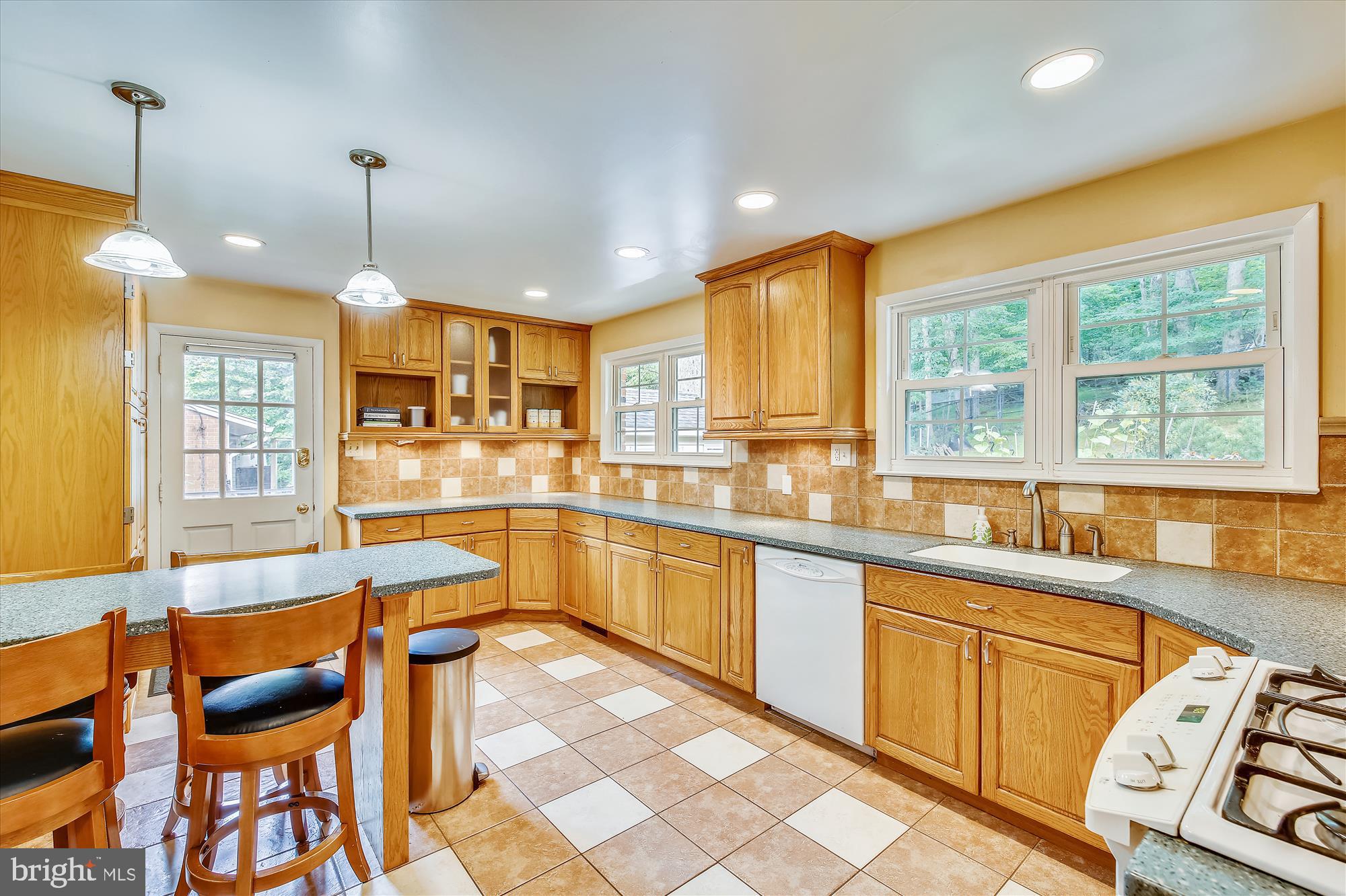 108 Claybrook Drive Silver Spring, MD 20902 - Photo 10 of 30 a large kitchen with granite countertop lots of counter space and window