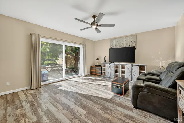 a bathroom with a granite countertop toilet a sink and mirror