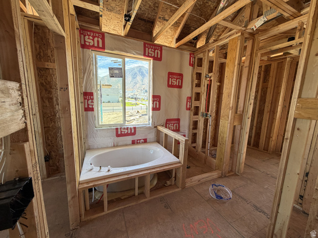 17 South Carson Way Salem, UT 84653 - Photo 6 of 14 Built-in corner bathtub with a framed window overlooking a mountain backdrop