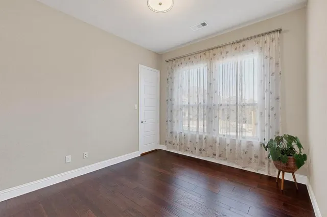 a view of an entryway with wooden floor
