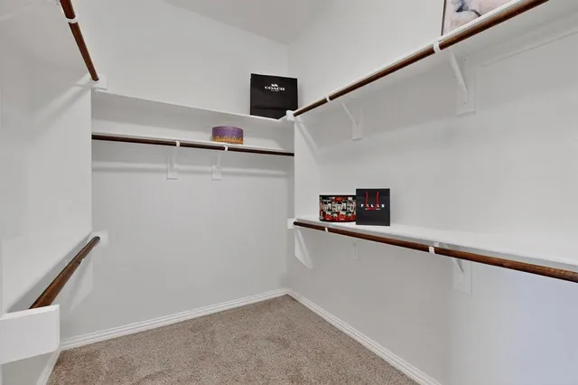 a bathroom with a granite countertop sink mirror and a bathtub