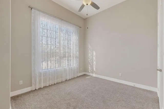 a spacious bathroom with a double vanity sink a mirror and a shower