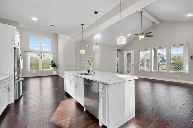 an aerial view of residential houses with outdoor space