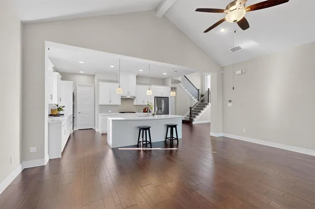 a view of a kitchen counter space wooden floor and windows