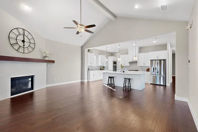 a view of kitchen with cabinets and wooden floor
