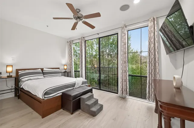 a bed sitting in a room next to a window