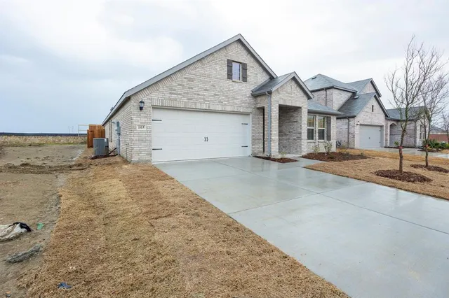 a view of a white house with a outdoor space