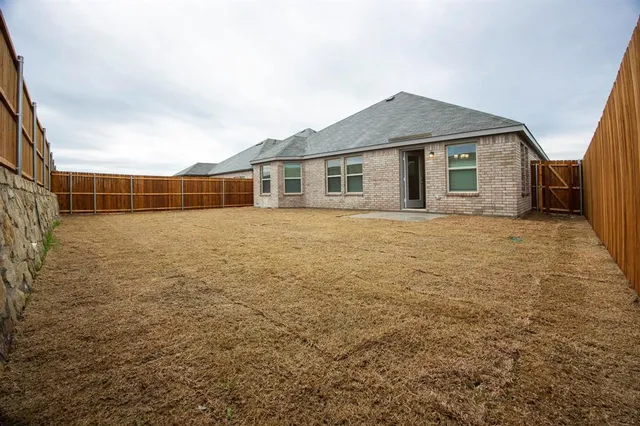 a house view with a backyard space