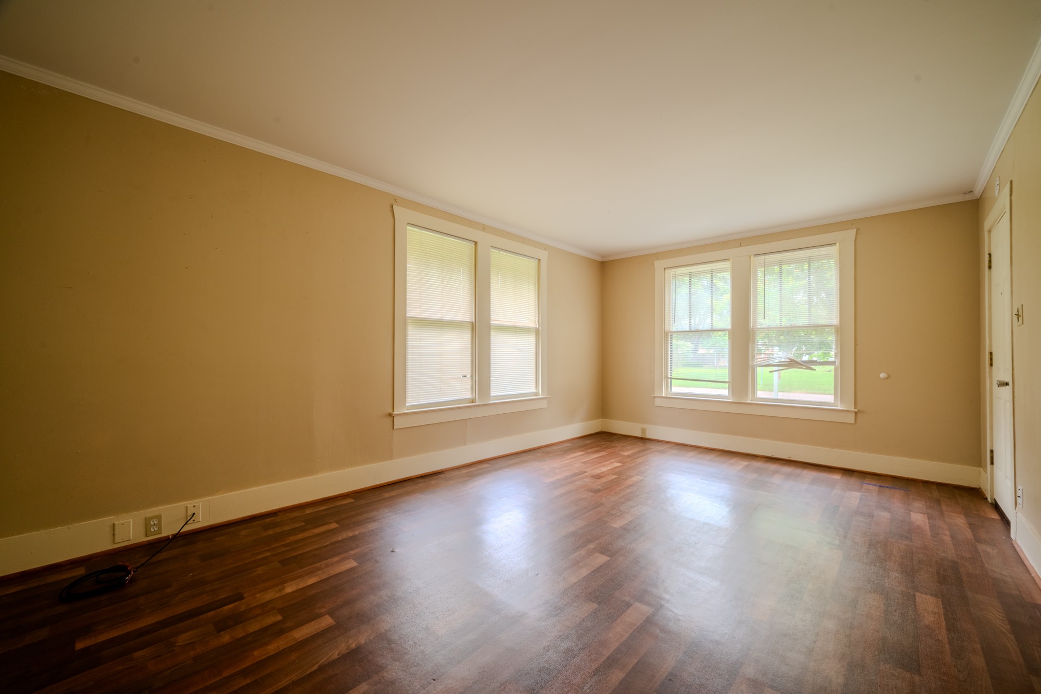 603 North Resident Street Wharton, TX 77488 - Photo 11 of 45 a view of an empty room with wooden floor and a window