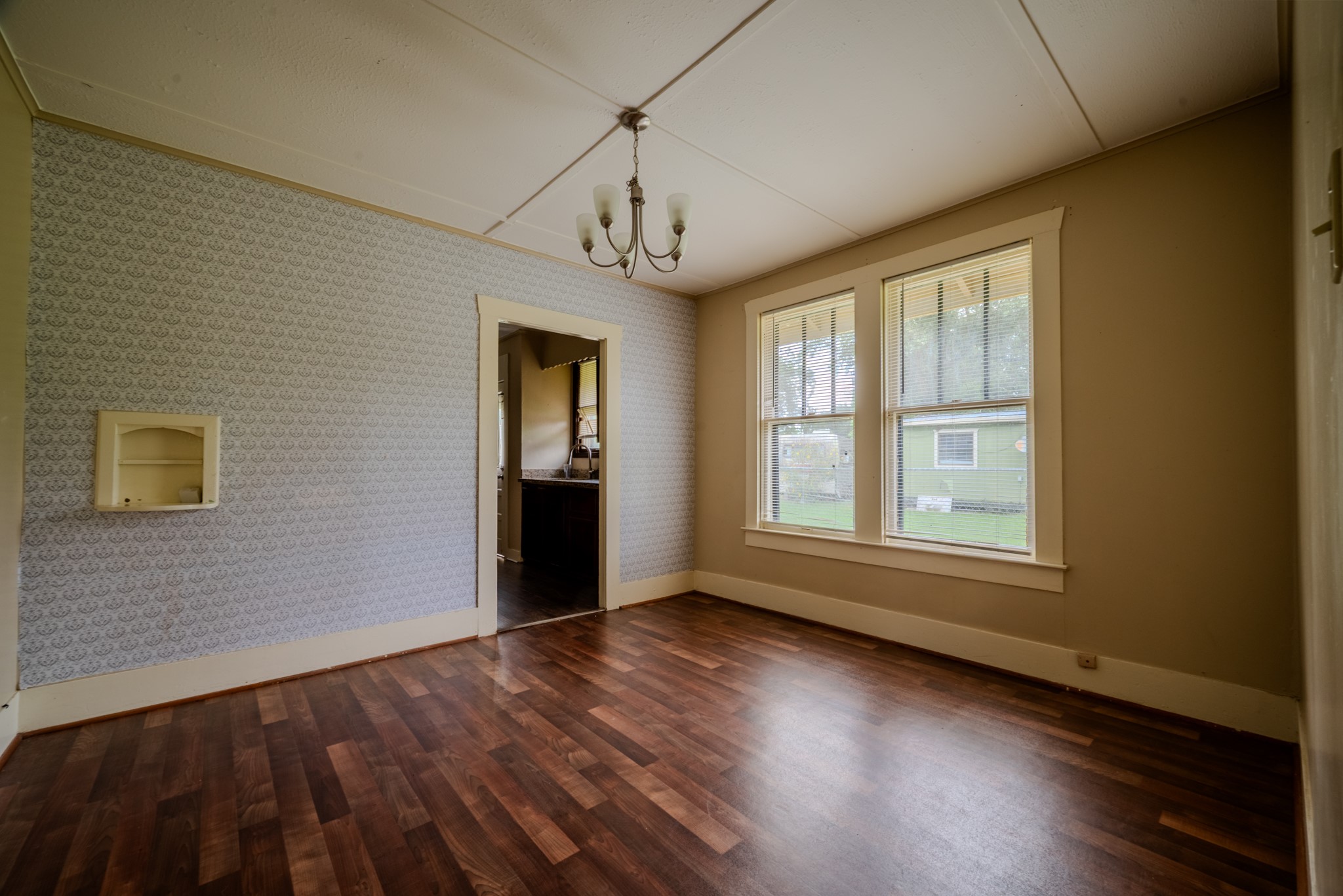 603 North Resident Street Wharton, TX 77488 - Photo 12 of 45 a view of an empty room with wooden floor and a window