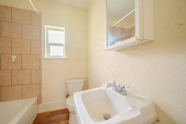 a bathroom with a sink and a bathtub