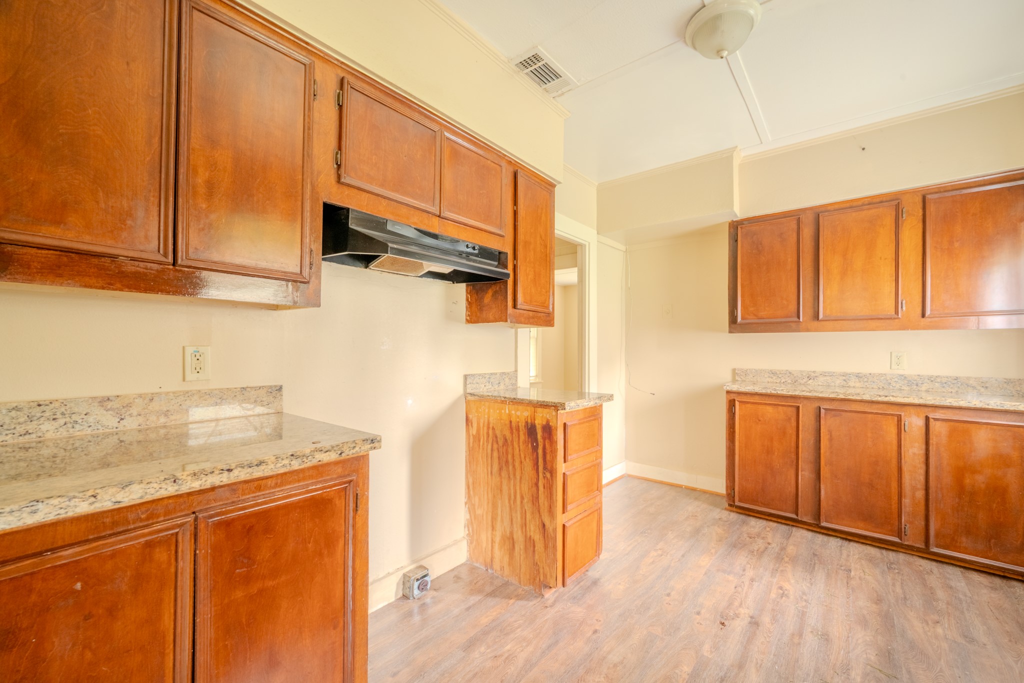 603 North Resident Street Wharton, TX 77488 - Photo 26 of 45 a view of a kitchen with stainless steel appliances granite countertop wooden cabinets and a counter top space
