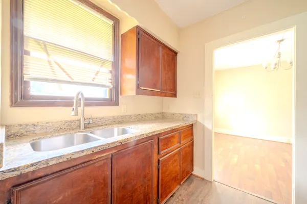 a kitchen with a sink and a window