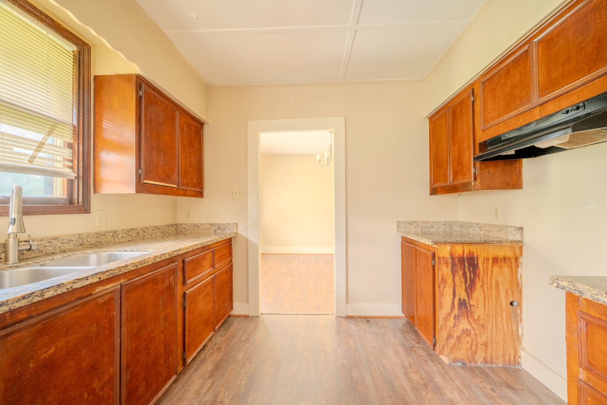 603 North Resident Street Wharton, TX 77488 - Photo 31 of 45 a view of a kitchen cabinets a sink and wooden floor