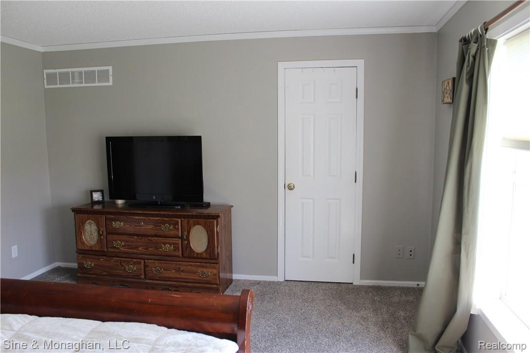 26523 Prinz Road Richmond, MI 48062 - Photo 31 of 61 VIEW OF OPPOSITE END OF MASTER BEDROOM SHOWING ENTRY DOOR TO WALK-IN CLOSET