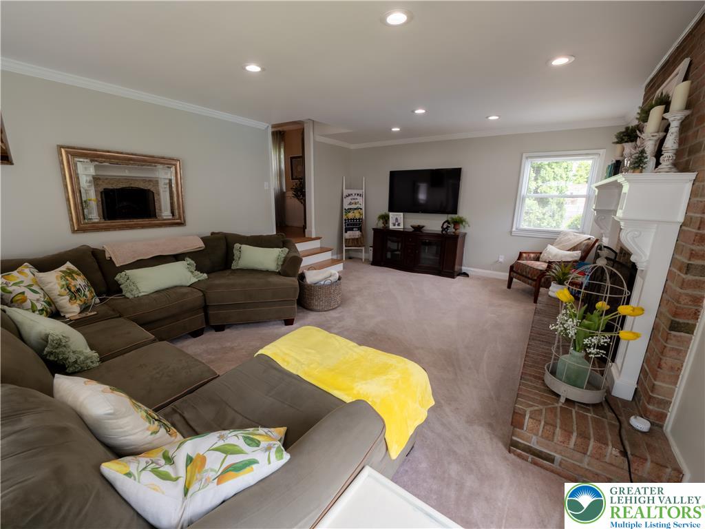 2087 Hopewell Road Bethlehem, PA 18017 - Photo 22 of 38 A comforting living room offers a brick fireplace and abundant natural light.
