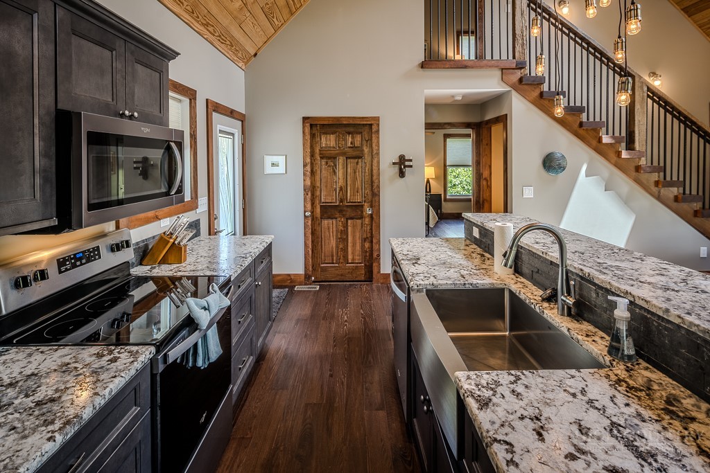 210 Grand Creek Road Vilas, NC 28692 - Photo 17 of 40 a kitchen with sink stove and cabinets