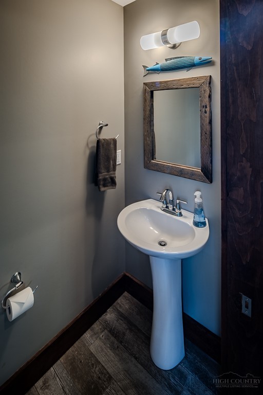 210 Grand Creek Road Vilas, NC 28692 - Photo 18 of 40 a bathroom with a sink toilet and mirror