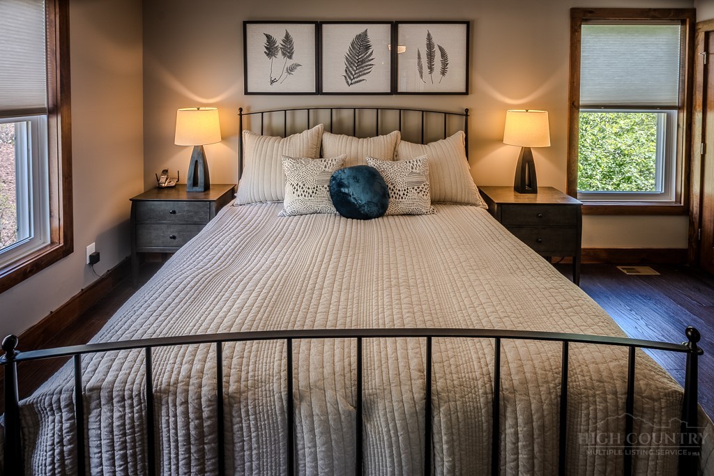 210 Grand Creek Road Vilas, NC 28692 - Photo 19 of 40 a bedroom with a bed and window