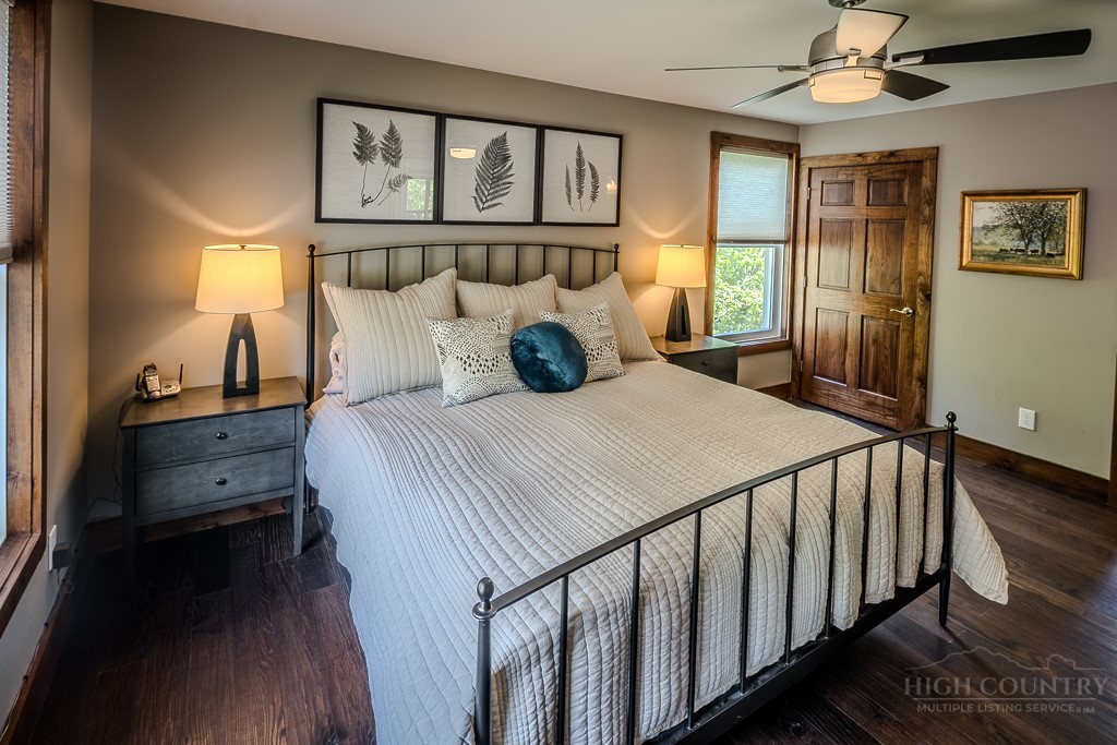 210 Grand Creek Road Vilas, NC 28692 - Photo 20 of 40 a bedroom with a large bed and a window