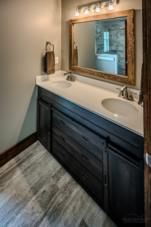 210 Grand Creek Road Vilas, NC 28692 - Photo 23 of 40 a bathroom with a sink and a mirror