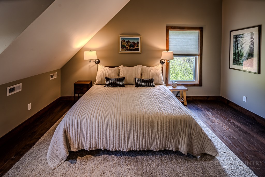 210 Grand Creek Road Vilas, NC 28692 - Photo 28 of 40 a bedroom with bed and window