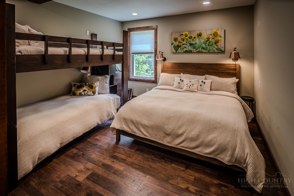 210 Grand Creek Road Vilas, NC 28692 - Photo 35 of 40 a bedroom with a bed and a window