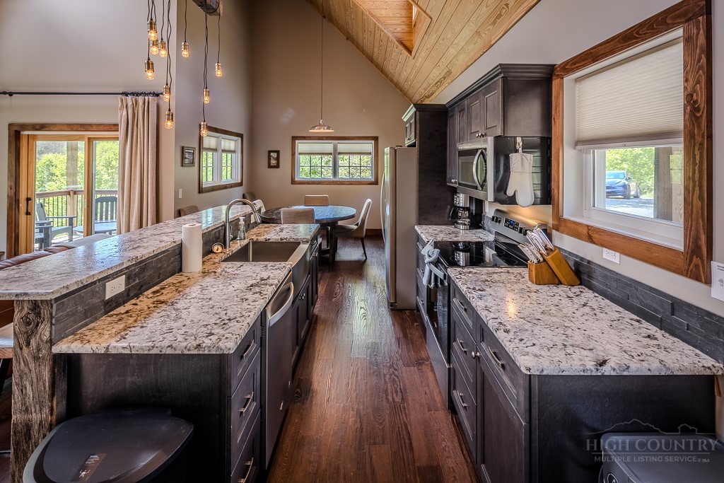 210 Grand Creek Road Vilas, NC 28692 - Photo 5 of 40 a view of a kitchen area with furniture and window