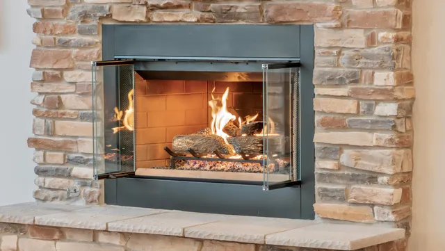 a kitchen with kitchen island granite countertop a sink cabinets a dining table and chairs