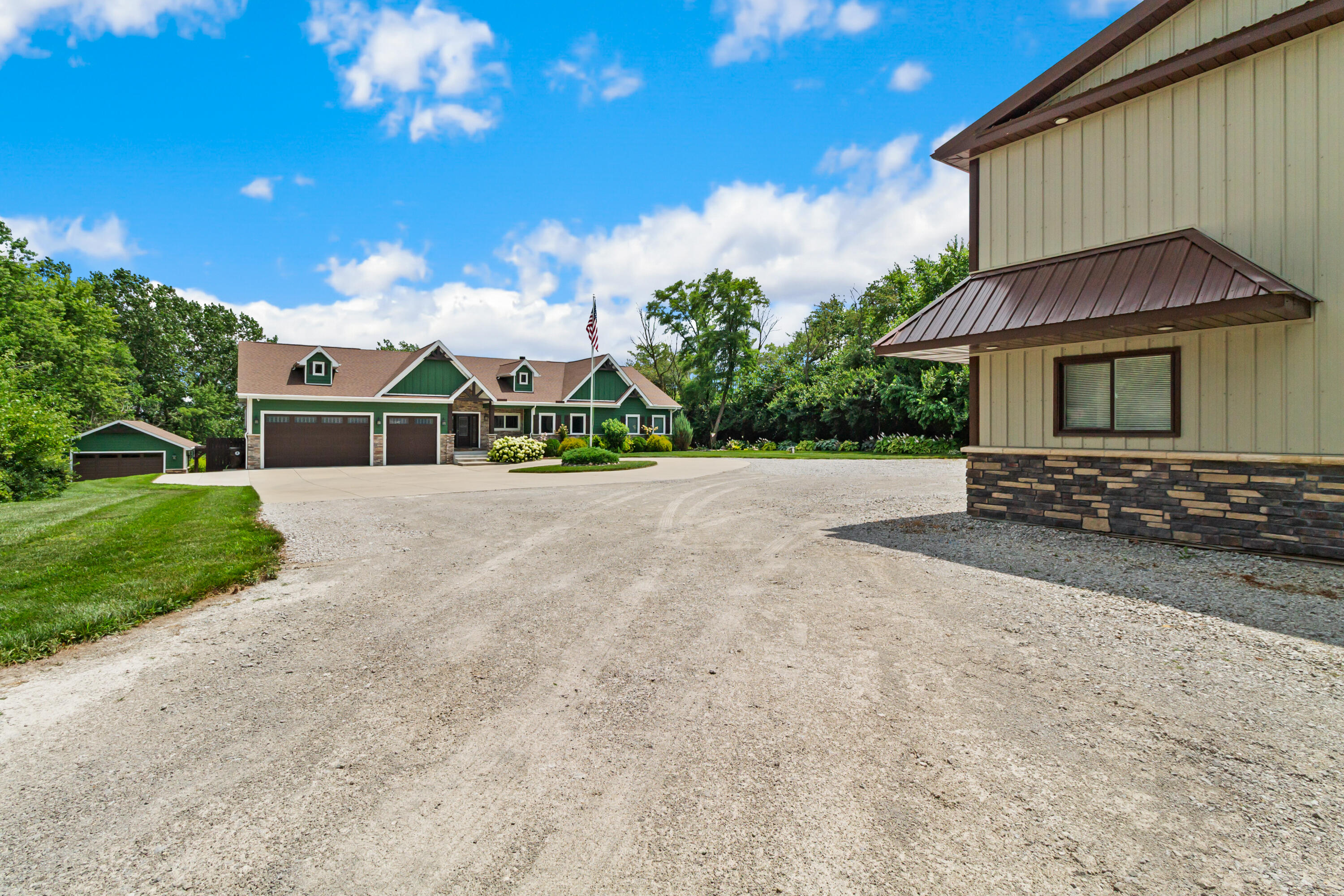 16489 Harrison Street Lowell, IN 46356 - Photo 2 of 67 a front view of a house with a yard and garage