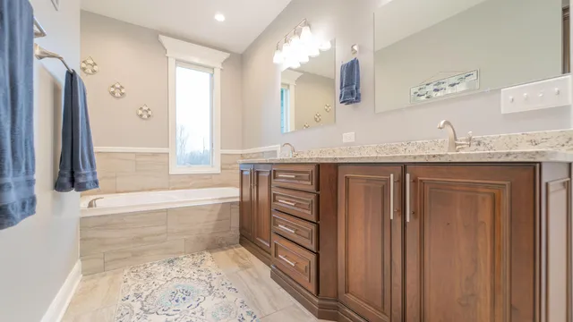 a bathroom with a sink and mirror