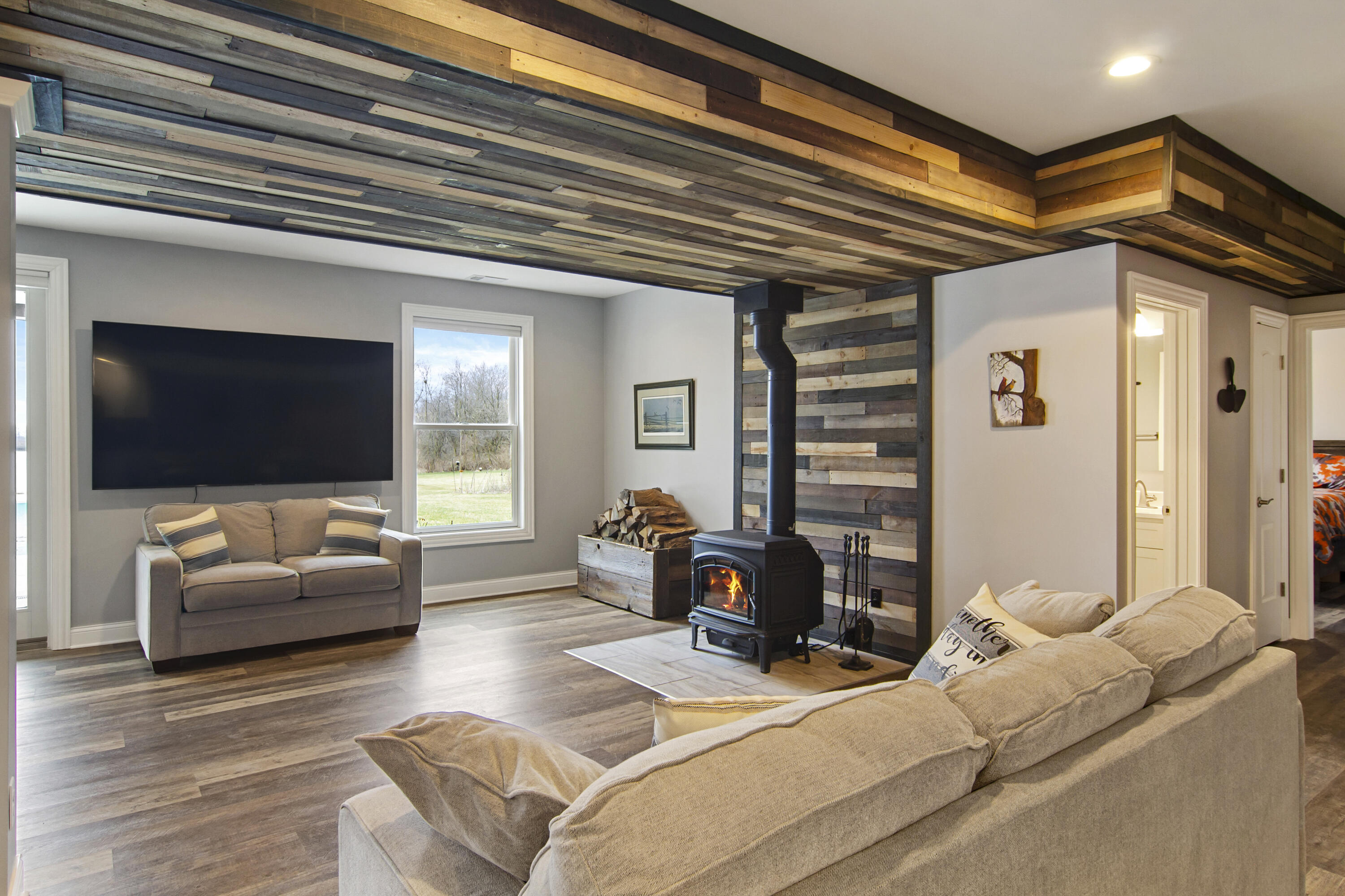 16489 Harrison Street Lowell, IN 46356 - Photo 41 of 67 a living room with furniture and a flat screen tv