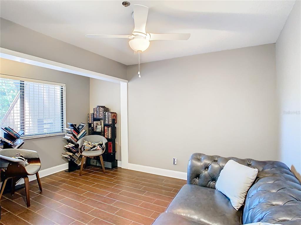 976 East Michigan Street, Unit A Orlando, FL 32806 - Photo 25 of 45 a room with furniture and a wooden floor