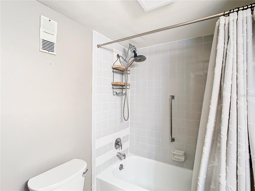 976 East Michigan Street, Unit A Orlando, FL 32806 - Photo 32 of 45 a bathroom with a shower and a toilet