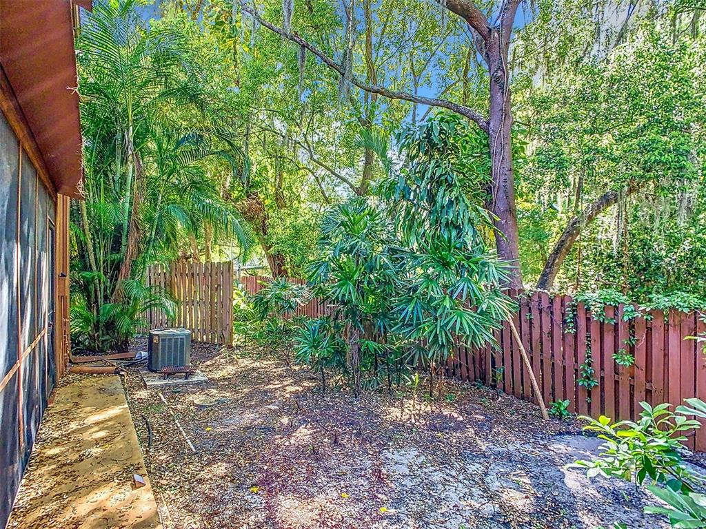976 East Michigan Street, Unit A Orlando, FL 32806 - Photo 38 of 45 a view of a garden with large trees