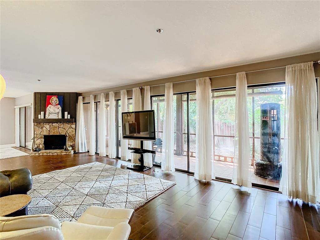 976 East Michigan Street, Unit A Orlando, FL 32806 - Photo 4 of 45 a living room with furniture and a flat screen tv