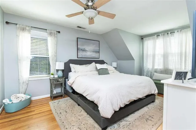 a bedroom with bed and a window