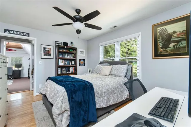 a bed room with a bed and a book shelf