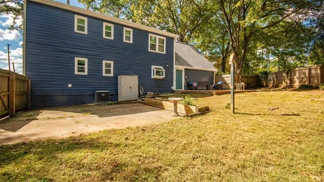 a view of house with yard